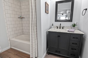 Combined shower/tub, hair dryer, towels, soap