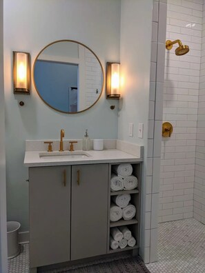 Shower, hair dryer, towels, soap