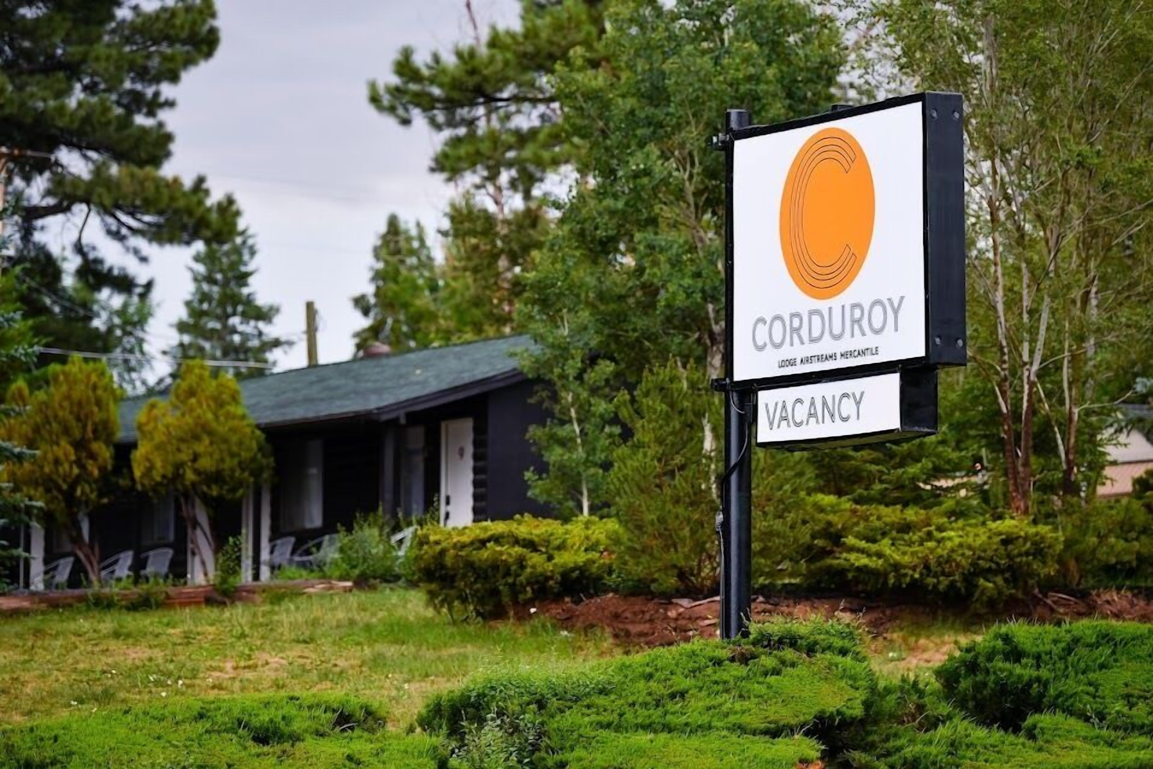 A sign for Corduroy Lodge & Cottages Mercantile indicating a vacancy.