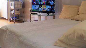 1 bedroom, desk, iron/ironing board, travel crib