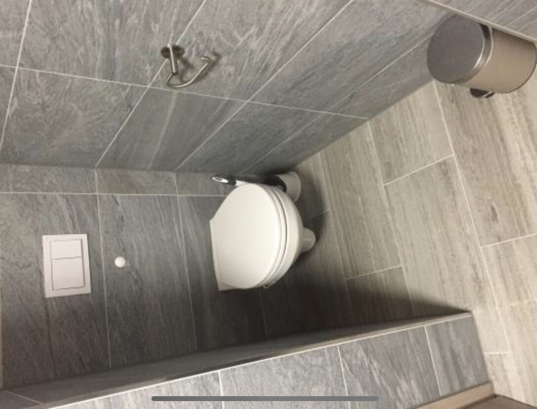 Bathtub, hair dryer, toilet paper