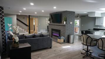 Smart TV, fireplace, books