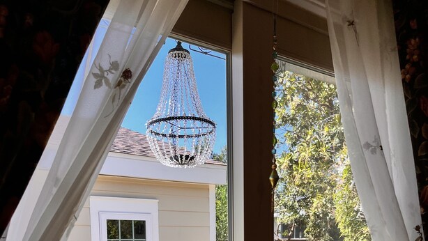 A view from a conservatory with a glass door, a hanging chandelier, and potted plants outside. - Serene Sonoma Home, Walk/bike downtown in minutes (Sonoma)
