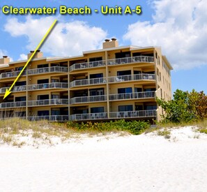 A multi-story hotel with balconies, located near a beach. - The Villas A-5 - Premium Plus 3 Bed/2 Bath Oceanfront Condo (Clearwater)