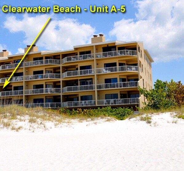 A multi-story hotel with balconies, located near a beach. - The Villas A-5 - Premium Plus 3 Bed/2 Bath Oceanfront Condo (Clearwater)