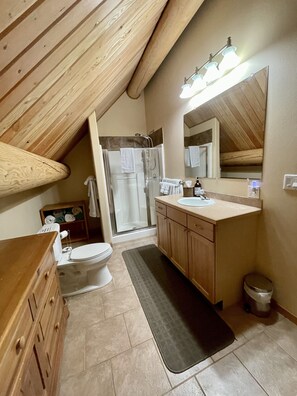 Bathtub, hair dryer, towels, soap