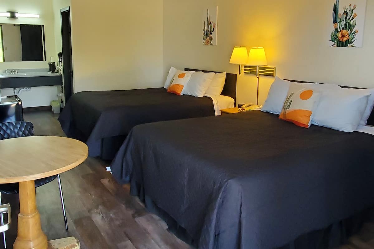 Standard Room, 2 Queen Beds, Non Smoking | 2 bedrooms, blackout curtains, iron/ironing board, free WiFi