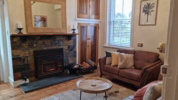 Deluxe House, 2 Bedrooms | Living area | 65-inch TV with digital channels, fireplace