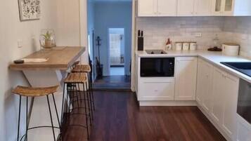 Deluxe House, 2 Bedrooms | Private kitchen | Oven, stovetop, dishwasher, coffee/tea maker