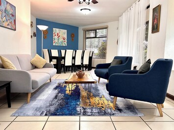 Formal living room with a table for 8