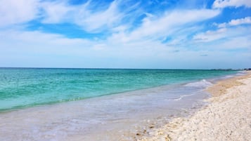 On the beach, sun loungers, beach towels
