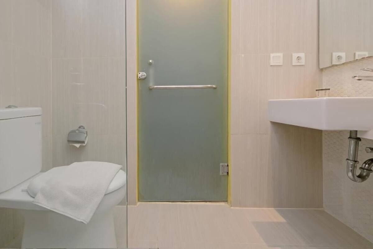 Bathroom | Shower, rainfall showerhead, slippers, towels