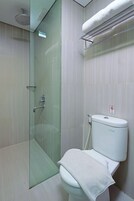 Shower, rainfall showerhead, slippers, towels