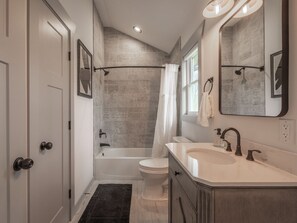 Combined shower/bathtub, hair dryer, towels, soap
