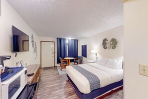 Relax in this cozy space with a comfortable bed, flat-screen TV, and convenient microwave.