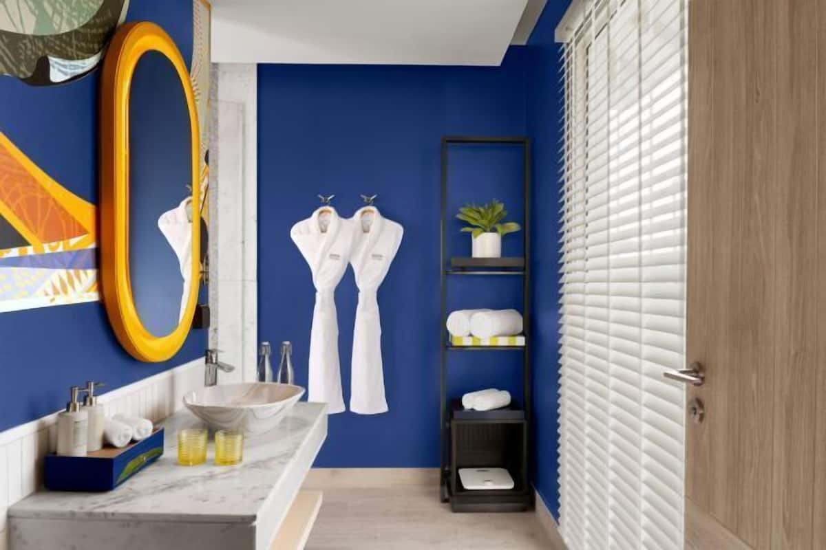 Separate tub and shower, rainfall showerhead, designer toiletries