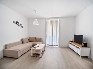 Superior Apartment | Living area | 27-inch flat-screen TV with digital channels, TV