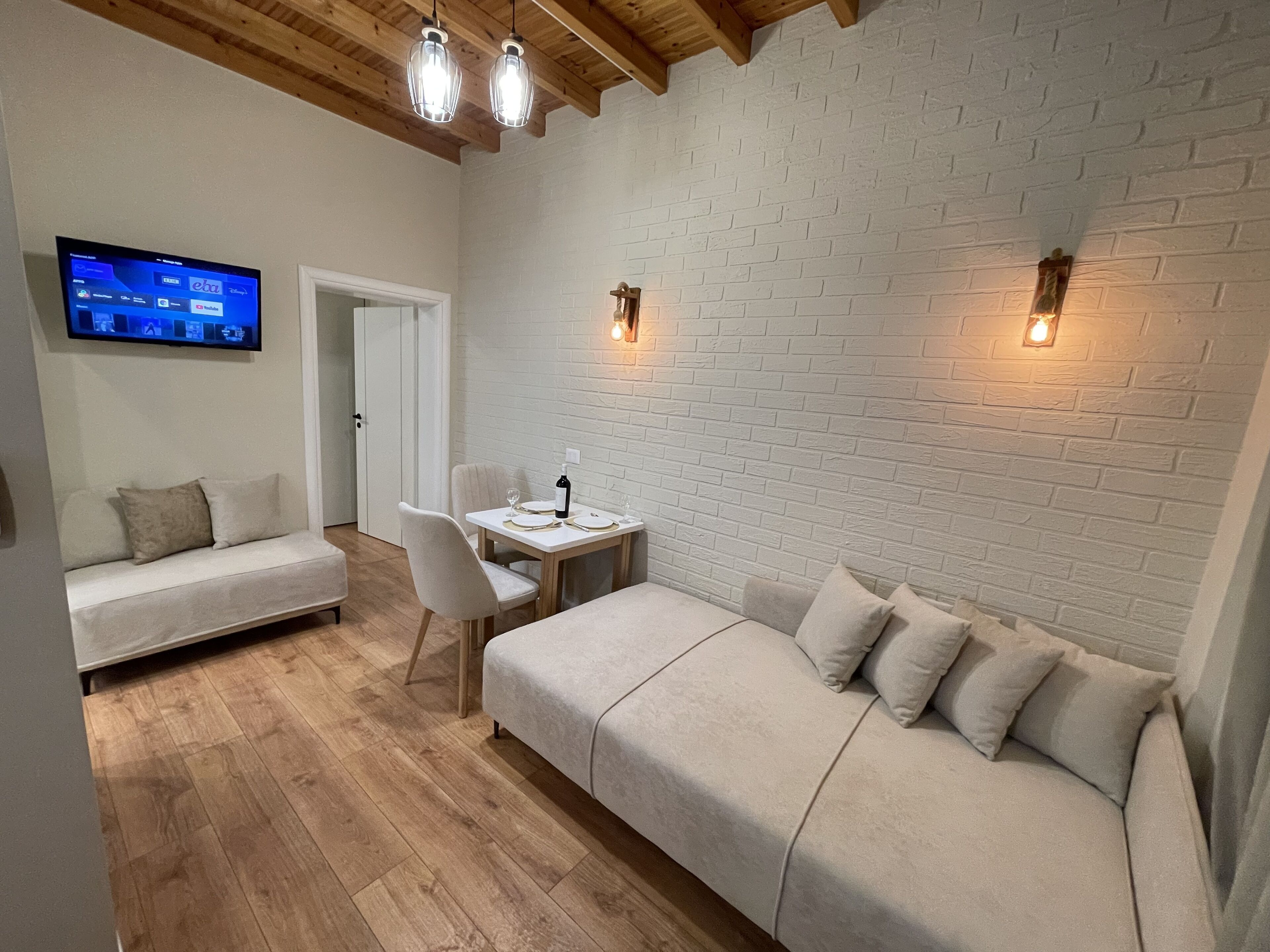 Deluxe Apartment, Balcony, Garden View | Living area | 32-inch Smart TV with cable channels, TV