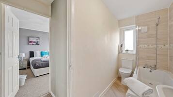 Bathtub, hair dryer, towels