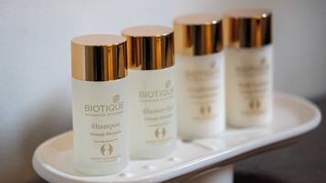 Four Biotique Advanced Ayurveda shampoo bottles on a white tray.