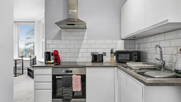 Fridge, microwave, oven, cookware/dishes/utensils