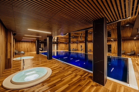 Indoor pool, seasonal outdoor pool, sun loungers, lifeguards on site