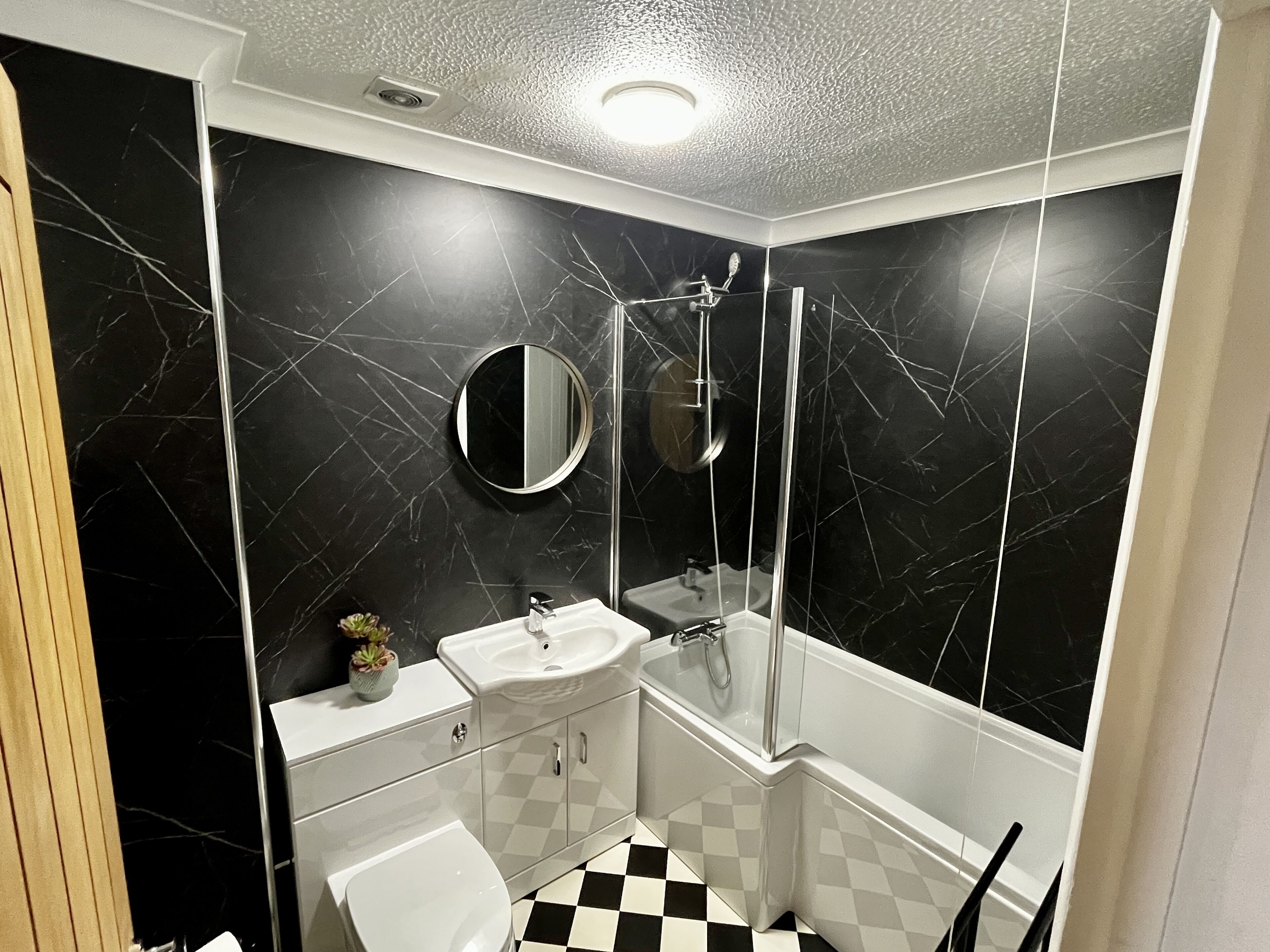Combined shower/bathtub, hair dryer, towels, toilet paper