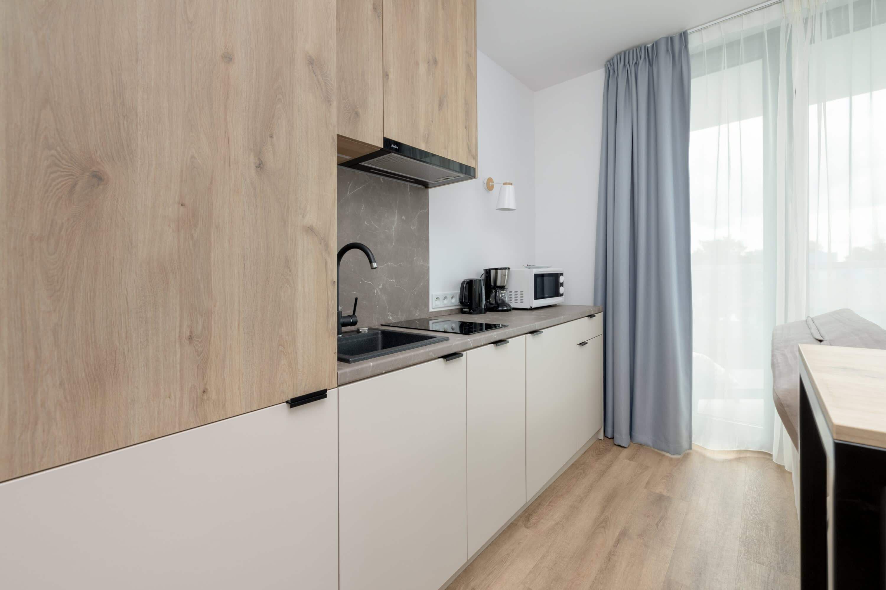 Fridge, stovetop, dishwasher, coffee/tea maker