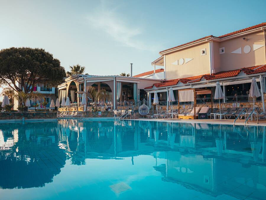 Seasonal outdoor pool, open 8:00 AM to 8:00 PM, pool umbrellas