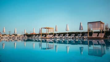 Seasonal outdoor pool, open 8:00 AM to 8:00 PM, pool umbrellas