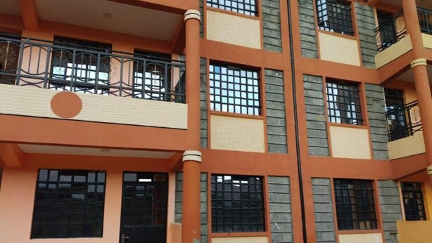 A multi-story building with balconies, large windows, and a patterned facade. - Stay.Plus Naivasha Budget Apartment (Naivasha)