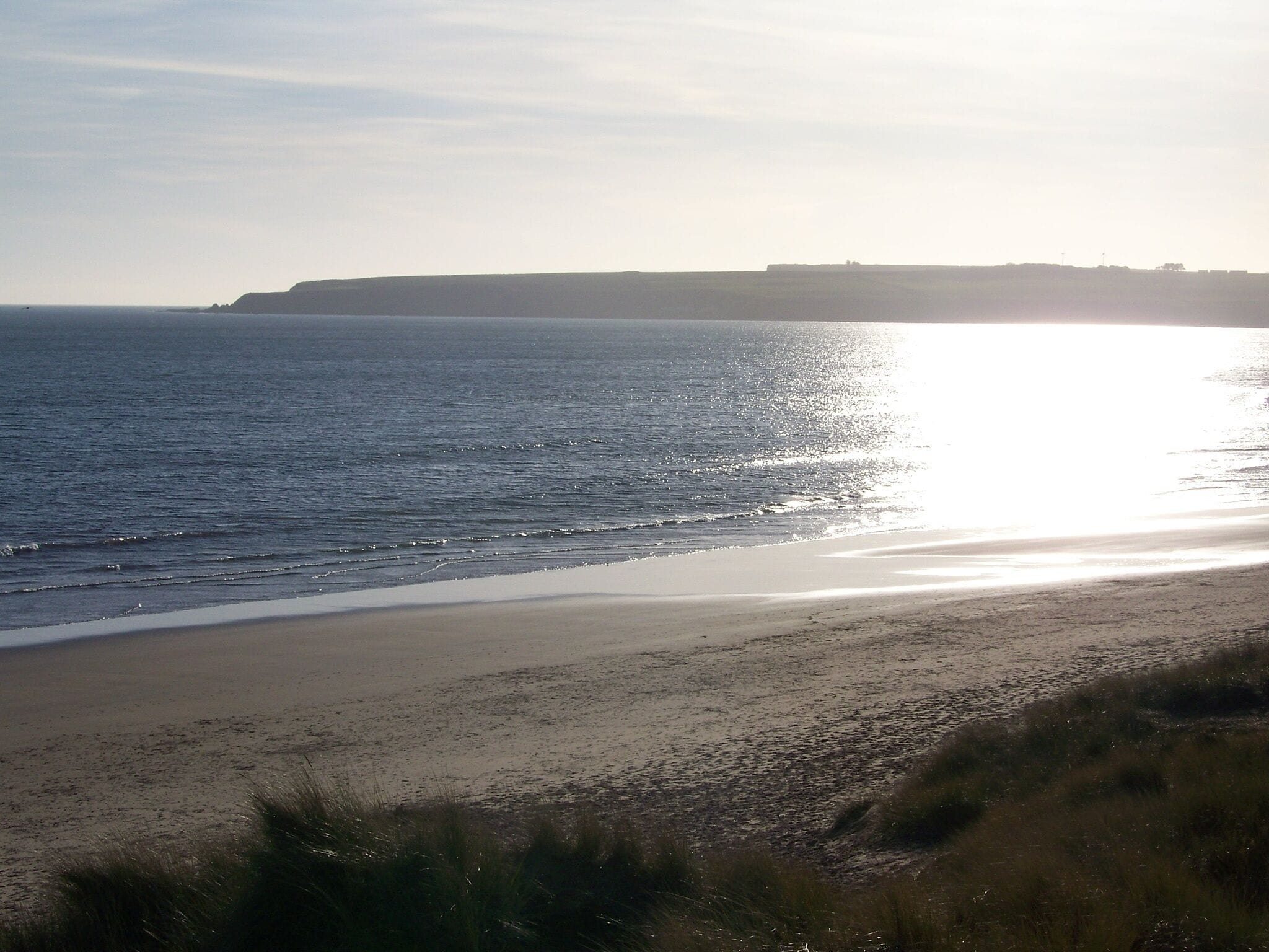 On the beach, sun-loungers