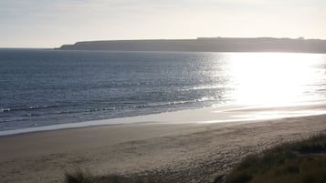 On the beach, sun-loungers