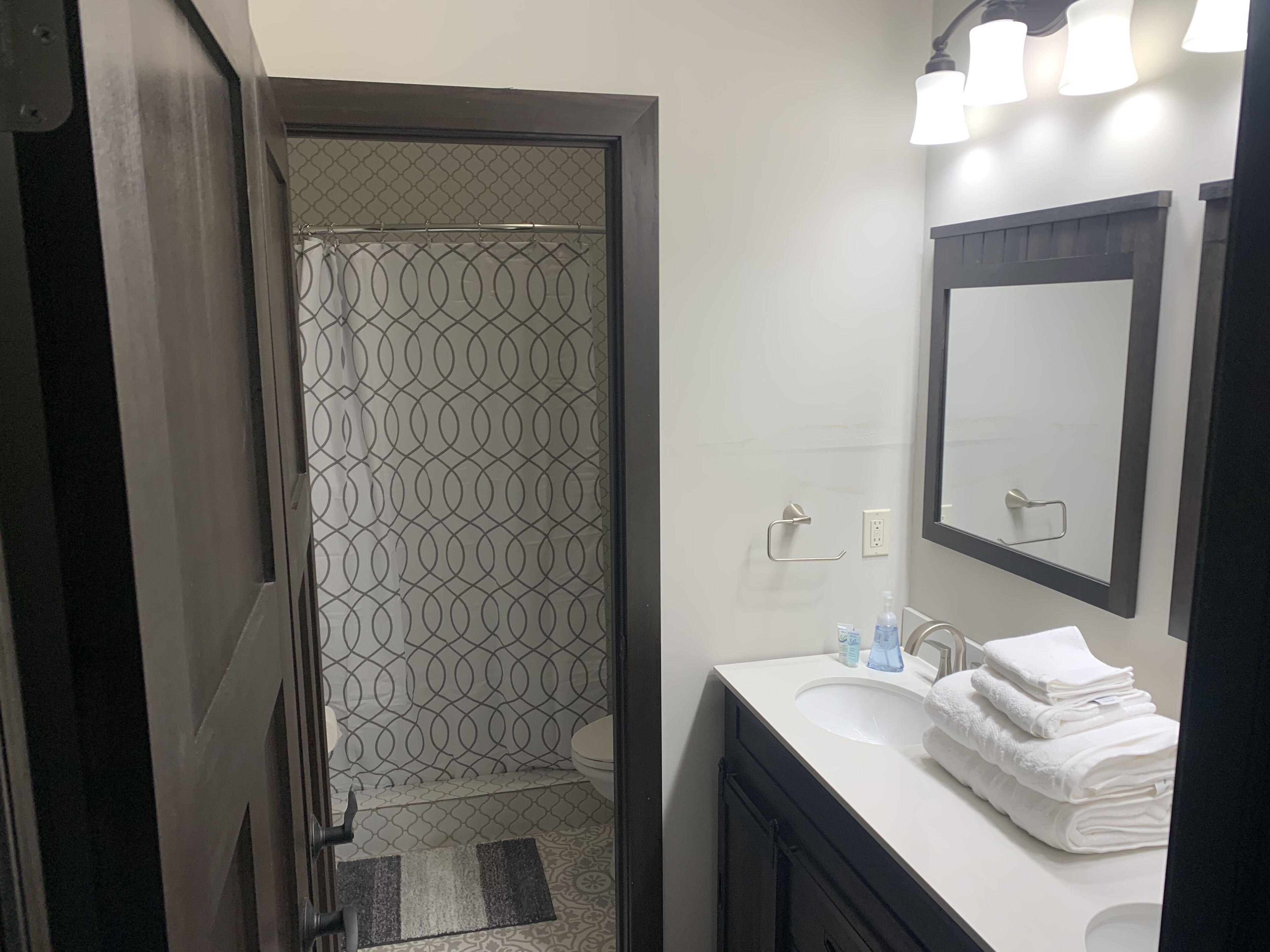 Bathtub, towels, soap, toilet paper