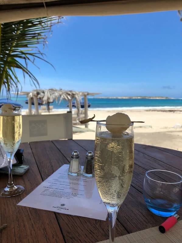 On the beach, sun-loungers, beach towels - Studio Ocean Sunrise, breathtaking sea view, swimming pool on Orient Bay beach (Cul-de-Sac)