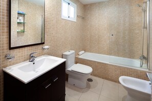 Bathtub, hair dryer, towels