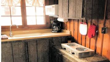 Full-size fridge, microwave, stovetop, coffee/tea maker