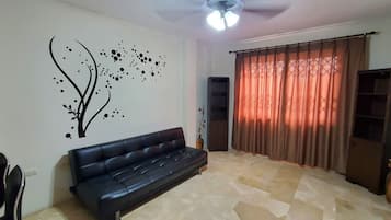 Business Apartment | Living room | 43-inch TV with digital channels, first-run movies, streaming services