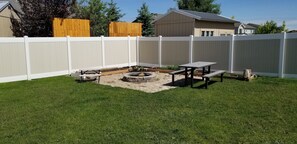 Backyard Firepit, Picnic Tables (big and little), Fenced Backyard