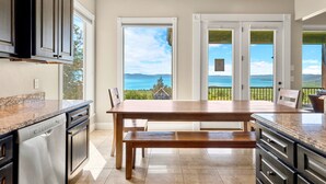 A kitchen with a large island, built-in appliances, and a view of the outdoors. - 7 acre Estate in Gated Reserve Community with Access to Pools, Beach, & Trails (Fish Haven)