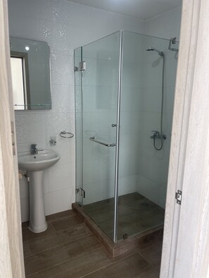 Shower, towels, soap, toilet paper