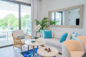 Deluxe Apartment, 1 Bedroom, Terrace, Pool View | Living area | 42-inch Smart TV with cable channels, TV - Xeliter Cana Rock Punta Cana (Punta Cana)