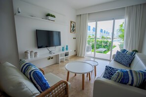 Deluxe Apartment, 2 Bedrooms, Balcony, Pool View | Living area | 42-inch Smart TV with cable channels, TV - Xeliter Cana Rock Punta Cana (Punta Cana)