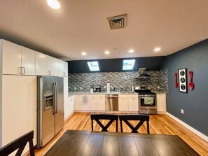 Enjoy meals in the kitchen with a dining area and oven.