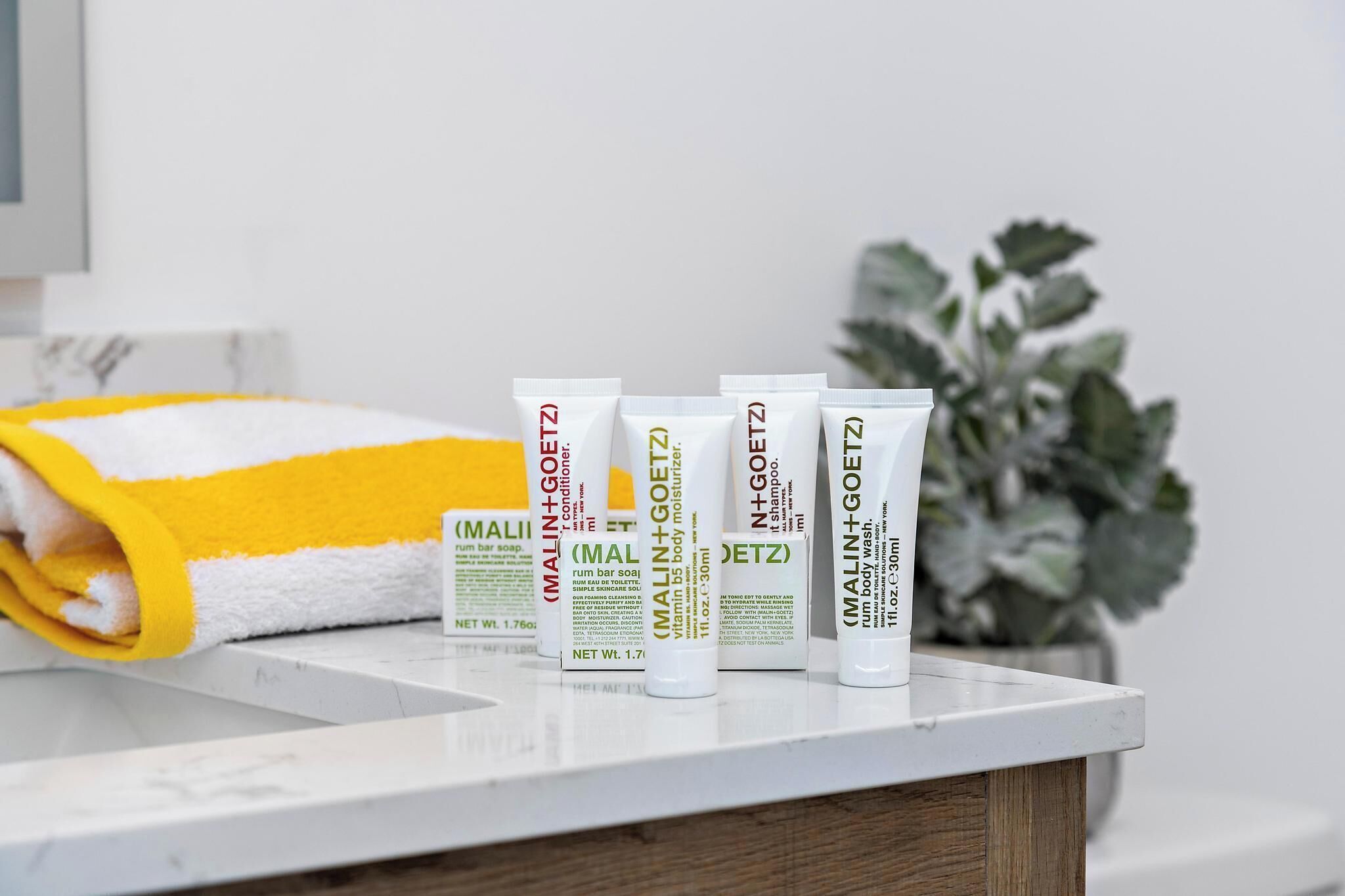 shower, designer toiletries, hair dryer, towels