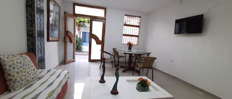 Basic Apartment | Living area | 32-inch flat-screen TV with cable channels, TV