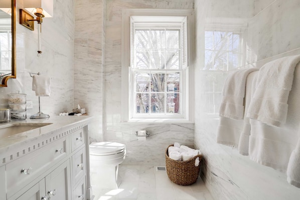 Bathtub, hair dryer, towels