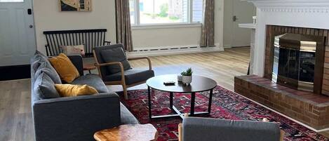 TV, fireplace, books