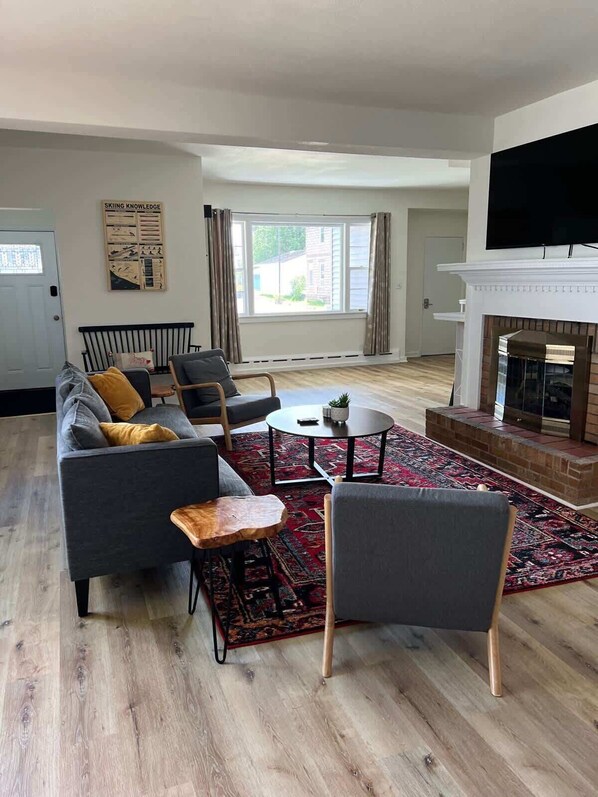 TV, fireplace, books