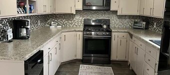 Spacious 4 BR 2BA Home with Bar and Fenced Yard